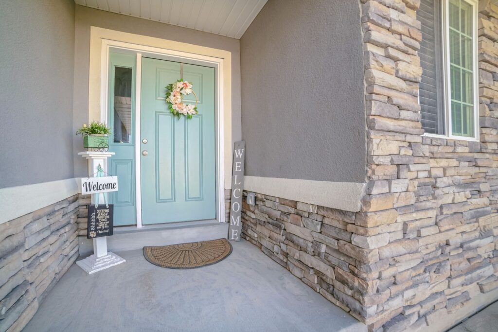 Blue Door With Welcome Signs