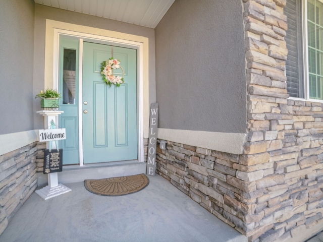 Blue Door With Welcome Signs